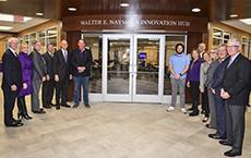 Members of Stephen F. Austin State University’s Board of Regents and university administrators stand with alumnus Walter E. “Loddie” Naymola during a dedication ceremony celebrating the Walter E. Naymola Innovation Hub.