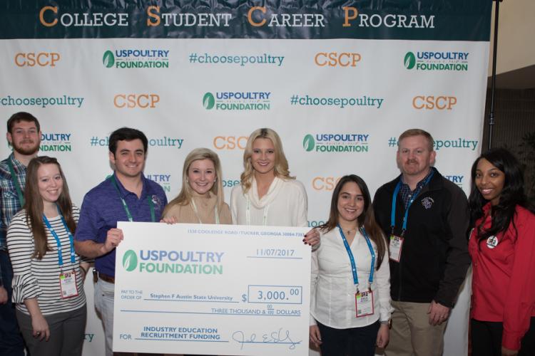 U.S. Poultry Foundation representatives present Dr. Joey Bray, chair of SFA’s Department of Agriculture and director of poultry science with the grant check.