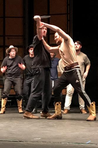SFA theatre students rehearse a fight scene in “Oklahoma!”.