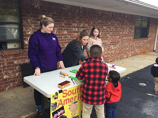 Emma Blinn and other SFA students recently volunteered at the Family Fun Night event at the Greater East Texas Community Action Program Head Start.