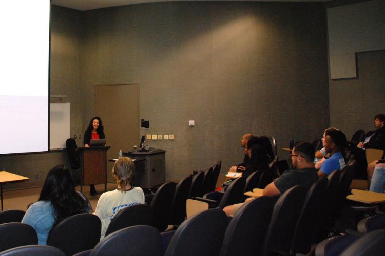Dr. Esther Teixeira speaking at the Women's and Gender Studies Symposium