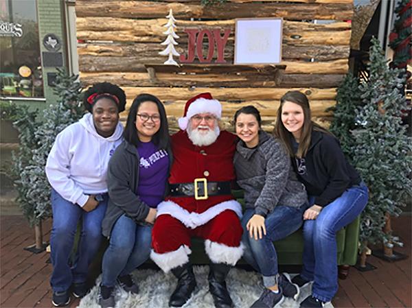 SFA hospitality students pictured with Santa