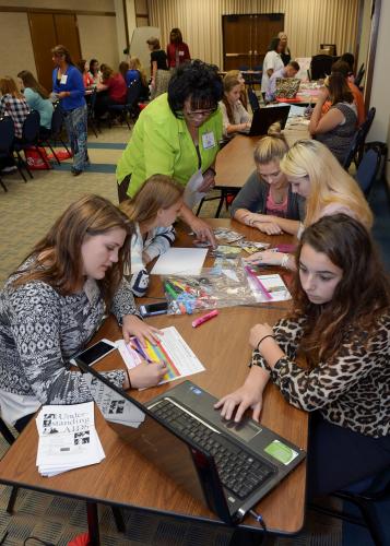 Camp director Mavis Yarbrough works with Groveton and Lufkin ISD students on an earthquake response simulation project