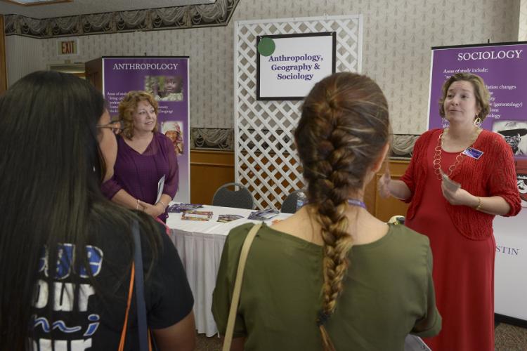 Dr. Leslie Cecil speaks with high school students during College Day