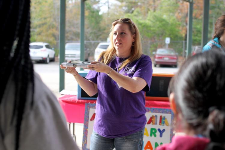 SFA EC-6 education major Christina Martin explains to fifth grade students how to play her legendary librarian game.