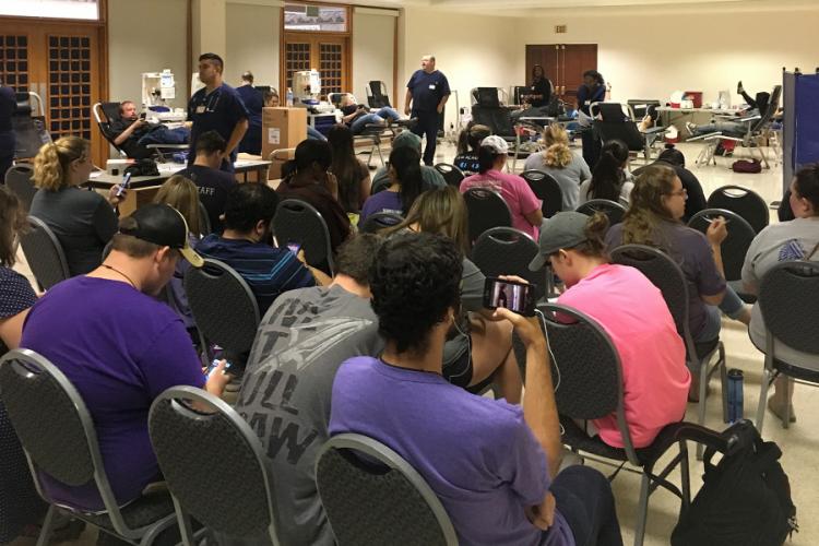 Stephen F. Austin State University students wait for a turn to donate blood in support of victims of the recent storms on the Texas Gulf Coast.