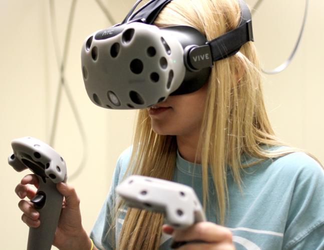 Leah Ball explores the ocean through a virtual-reality experience in the Steen Library’s new Emerging Technologies Lab