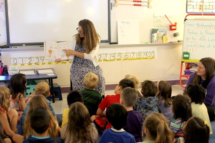 Dr. Judy Abbot reading to a group of first grade students at the SFA Charter School for the annual Read for the Record.