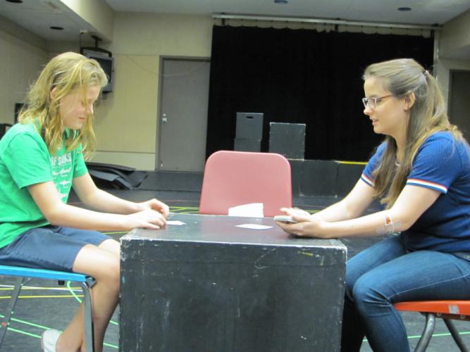 Guest actor Mae Johnston, 12, in the role of 7-year-old Josie, and SFA theatre student Maggie Strain, in the role of Mrs. Kilbride, rehearse a scene from Marina Carr’s “By the Bog of Cats.”