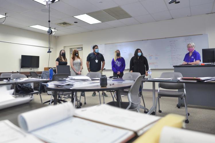 Sally Ann Swearingen and her team of five interior design seniors inside one of the safe learning environment classrooms on the SFA campus