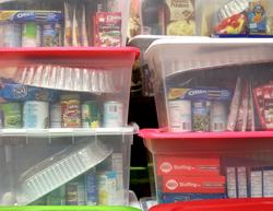 storage bins containing donated items ready to be delivered to families in need
