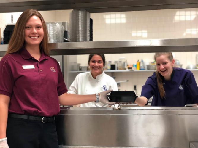SFA students Kamrin Sprott, Arlene Turcios and Kelly Allen at work at The Country Club of Little Rock in Arkansas during the summer to meet their internship requirements for the hospitality administration program. 