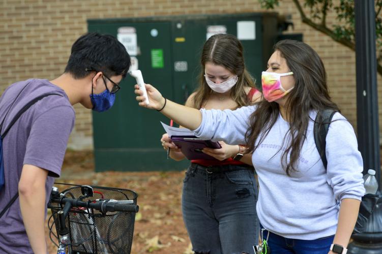 photo of SFA voice students checking temperature