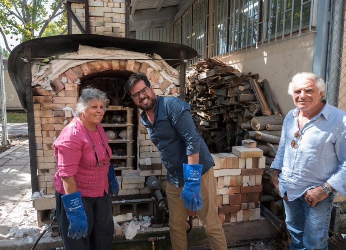 Fenci and his Mexican colleagues prepare to unload a high-fire kiln Fenci and students built at la Universidad Autonoma de Chihuahua.