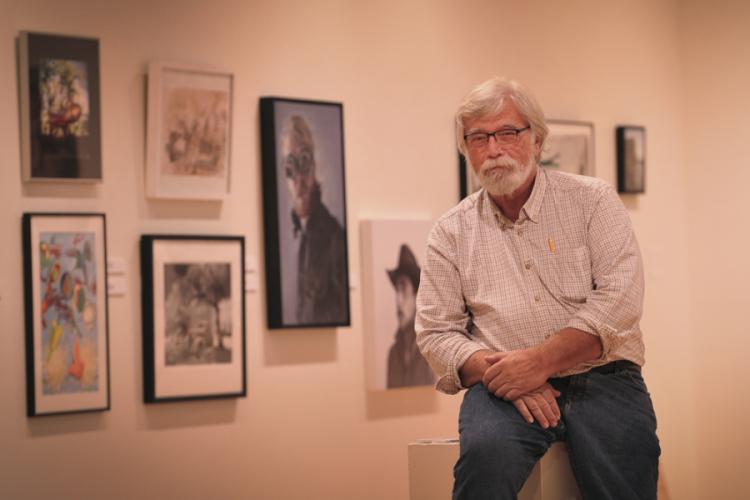 Gary Parker, recently retired SFA art faculty member, poses in The Cole Art Center @ The Old Opera House