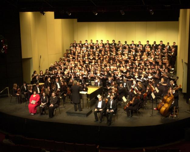 photo of SFA's combined choirs and orchestra on stage in Turner Auditorium