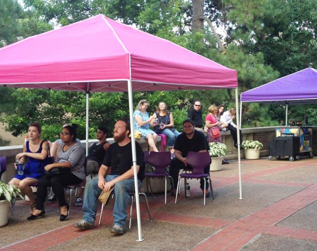 Audience members at the 2014 SummerStage Festival at SFA enjoy pre-show entertainment outside.