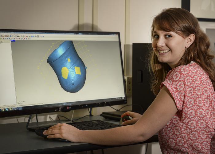 SFA history graduate student Amanda Carr of Pollok works with a digitized representation of a Caddo vessel in an SFA Center for Regional Heritage Research office.
