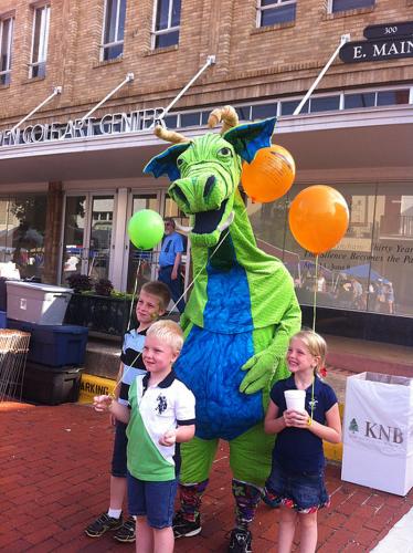 children being photographed with the popular dragon character Schlaftnicht