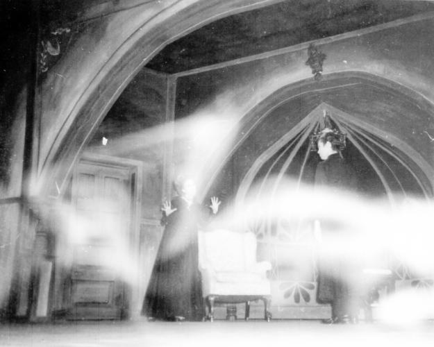 photo taken on the set of "Tiny Alice" showing a vaporous image across the screen