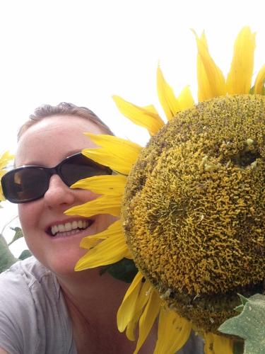 Laura Miller picture with a sunflower