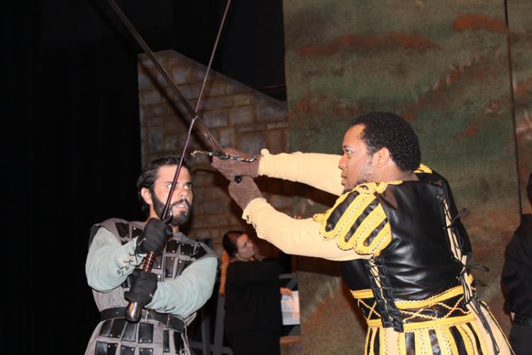 SFA theatre students Keenan Chaisson, left, as Macduff and Dominique Rider as Macbeth engage in a fight scene in the School of Theatre's production of Shakespeare's "Macbeth."