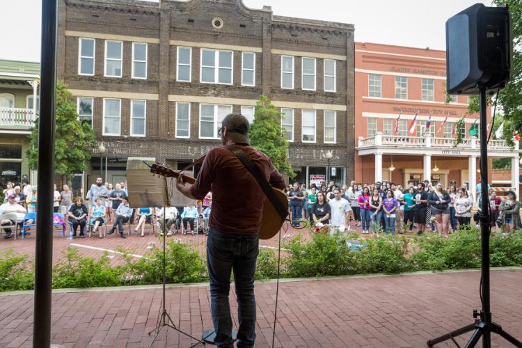 Grant Howarth performing on the south side of the Nacogdoches downtown square