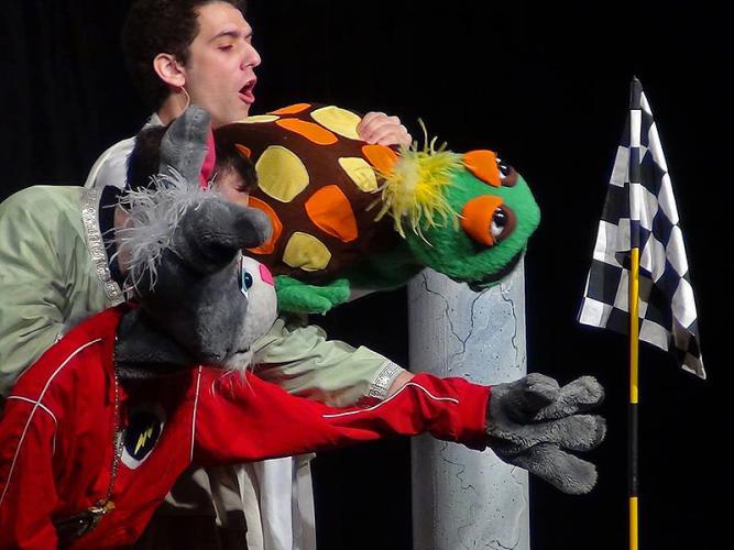 SFA theatre alumnus Nick Pinelli rehearsing with puppets