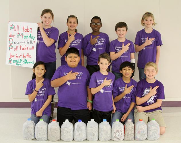 photo of some of SFA's Charter School students involved in collecting 12,000 aluminum pull tabs to donate to the Ronald McDonald House in Houston