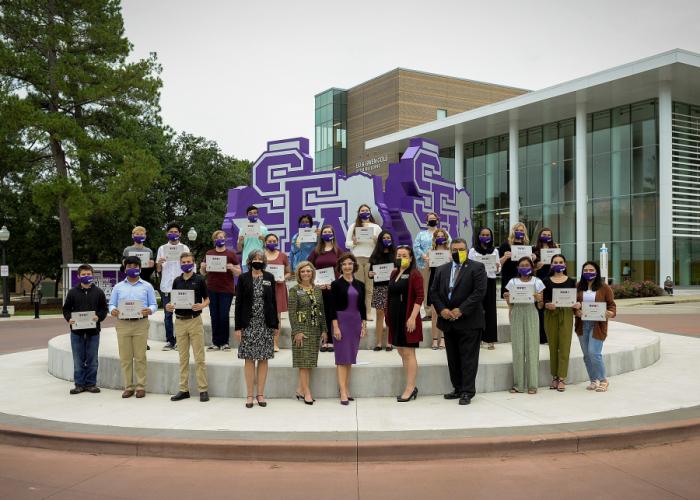 The newest Nacogdoches ISD cohort inducted into SFA's STEM Academy pictured in front of the STEM Building.