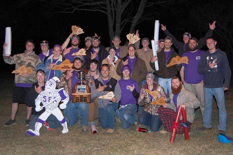 Members of the Stephen F. Austin State University Sylvans club display their Lumberjack pride and awards earned at the 57th annual Southern Forestry Conclave in Virginia.