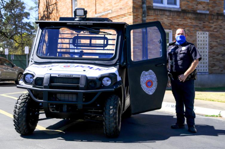 Robert McDonald, Stephen F. Austin State University police officer II, stands next to one of the University Police Department’s new community relations vehicles.