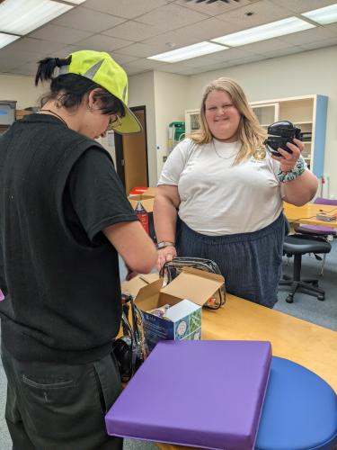 SFA theatre students Connor Molen, Ponder sophomore, and Olivia Cantrell, Brenham junior, put together sensory bags for the SummerStage Festival.