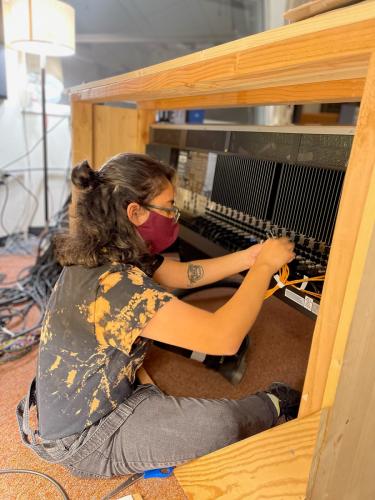 Andrea Pacas connects outboard gear to the SSL console