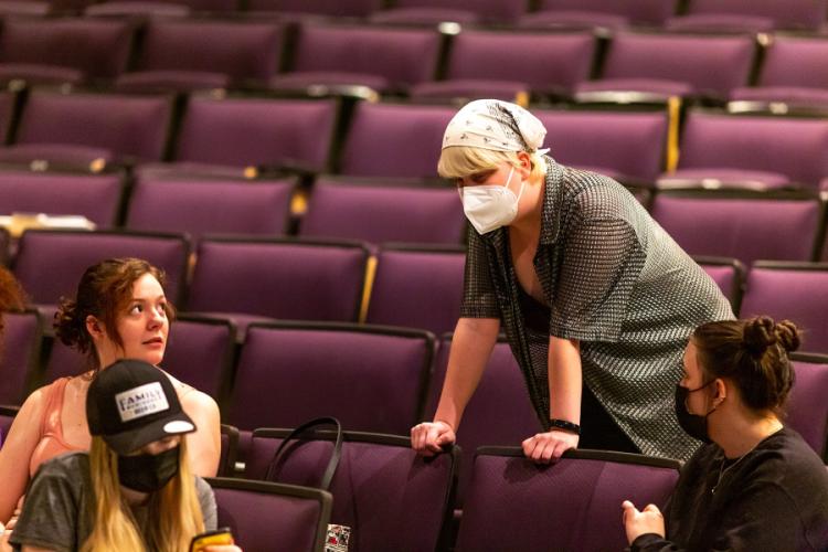 Gonzales senior theatre student and intimacy director for “The Moors” Theo Moers discusses the play with cast members during a rehearsal 