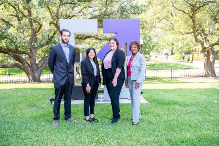 Preston Pennington-Sahs, an economics senior from Frisco who earned first place in the macroeconomics category; Martarosa Velazquez of Lufkin, who graduated in May with a Bachelor of Business Administration in marketing and earned seventh place in the marketing analysis and decision-making category; Kristen Baker, a finance junior from Nacogdoches who earned 10th place in the marketing concepts category; and Dr. Marice Jackson, assistant professor of business communication and legal studies as well as facu