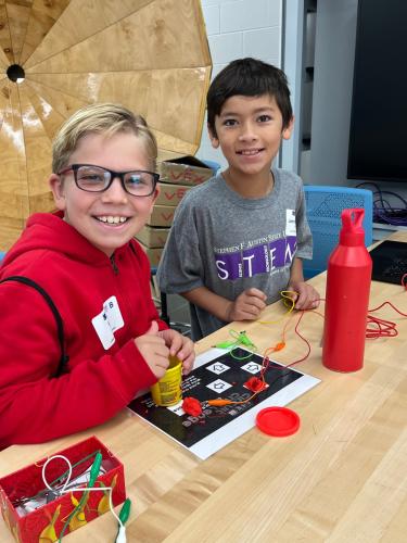 Stephen F. Austin State University Little STEM Jacks campers use Play-Doh to control a circuit board.