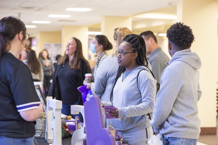 prospective students asking questions at a Showcase Saturday event