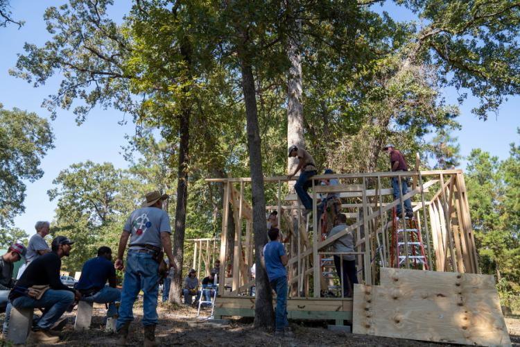 students from SFA's School of Human Sciences building a tiny home