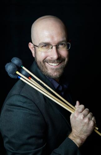 Percussionist Brad Meyer holds a set of mallets