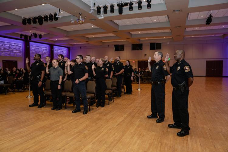 Officers of Stephen F. Austin State University’s police department take a formal oath for dual commission with The University of Texas System’s police force during a ceremony Monday in the Baker Pattillo Student Center.