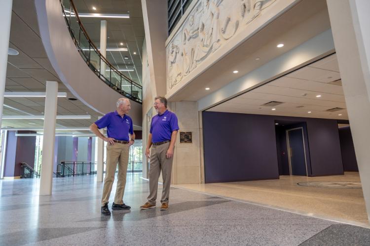 Dr. Gary Wurtz and Bill Elliott admire the beautiful interior of the newly renovated and expanded Griffith Fine Arts Building