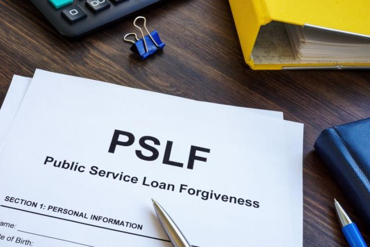 form with the title "PSLF: Public Service Loan Forgiveness" laying on a desktop