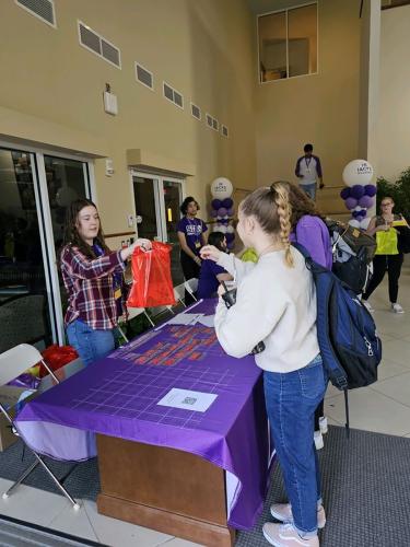 SFA hospitality students organized check-in, handled volunteer assignments, set up food and beverage stations, and completed related tasks throughout the day.