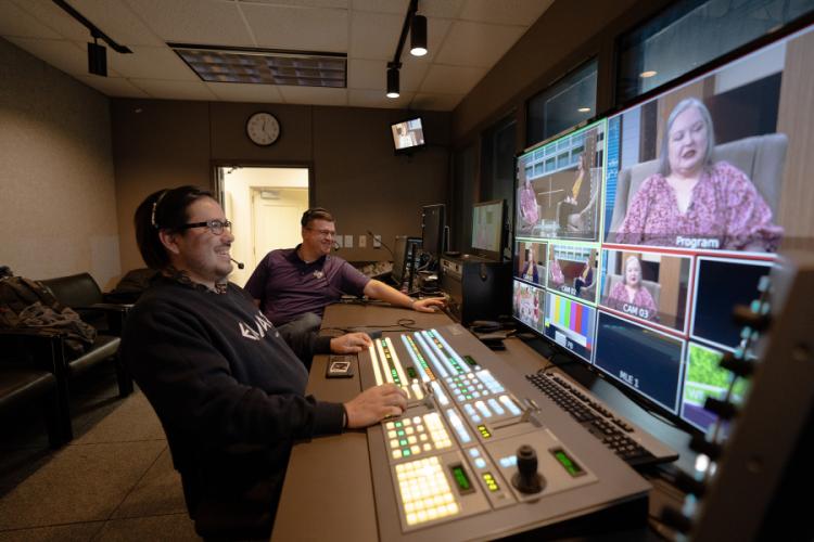 Norris Seward, senior mass communication major from Livingston, and Dr. Casey Hart, mass communication professor and “We Are Nacogdoches” program producer and director, work in the control room during a filming of the program.