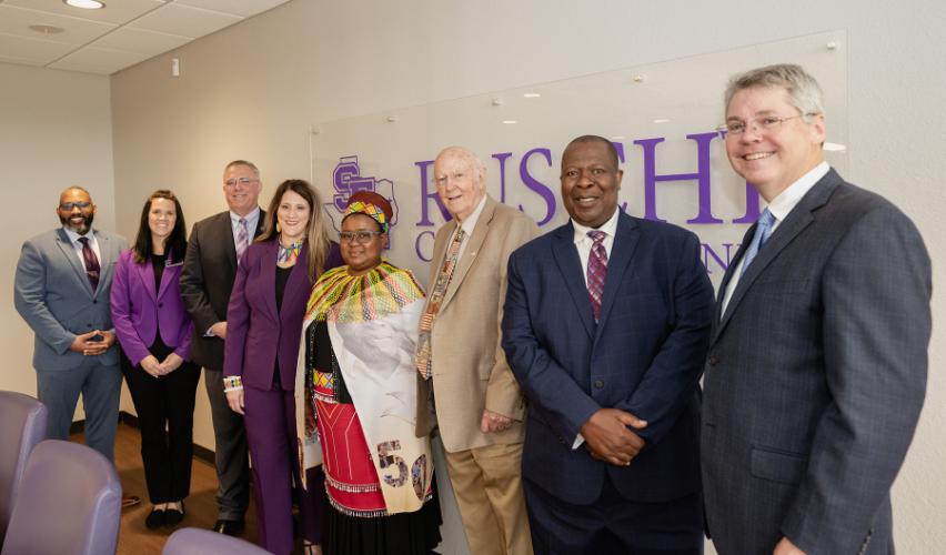 Lee Arnold and Amy Mooneyham, two MBA students who worked on the Light for Africa Ministries project; Dr. Tim Bisping, dean of the Rusche College of Business; Gina Oglesbee, interim president of SFA; Queen Nompumelelo; Bob Flournoy, a Lufkin attorney; the Rev. Dr. Jeremiah Mdlalose, director of Light for Africa Ministries; and Dr. Marcus Cox, coordinator for SFA’s Business and Community Services office.