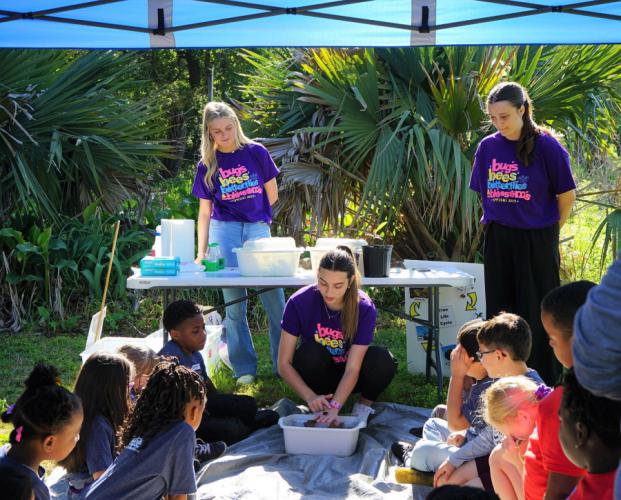 Students taking the “Teaching Science in EC-6” course demonstrate learning activities they learned to students in kindergarten through third grade.