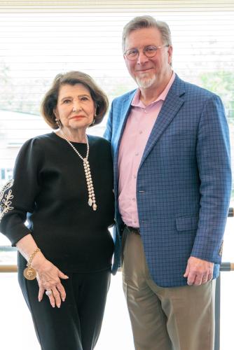 Priscilla “Prissy” Sliva tands with Dr. Gary Wurtz, dean of the Micky Elliott College of Fine Arts.