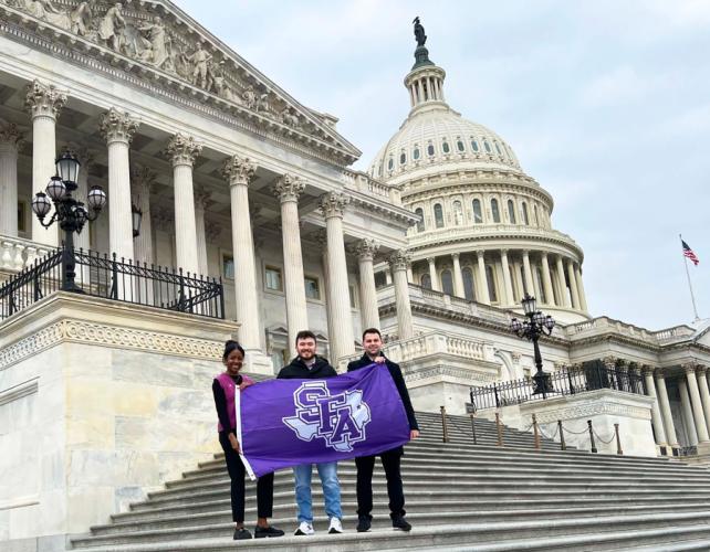 Jada Cartwright, a criminal justice major from Lockhart; Nathan Lyons, a political science major from Lufkin; and Casper Dirkx, a political science major from Spaarndam, Netherlands at the steps of the U.S. Capitol in Washington, D.C.