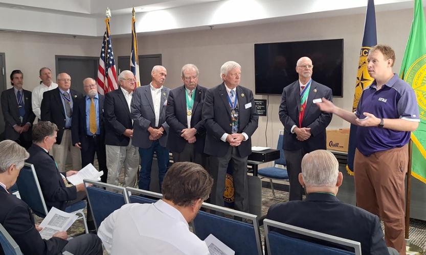 Kyle Ainsworth accepts a donation to the SFA East Texas Research Center given by members of The Sons of the Republic of Texas